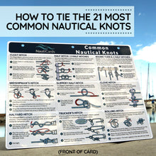 Load image into Gallery viewer, Front of nautical knots card with illustrations and text on a clear sky background at a marina.